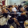 시위대에 엽총 겨눴던 ‘민머리’ 홍콩경찰, 中 건국행사 초청