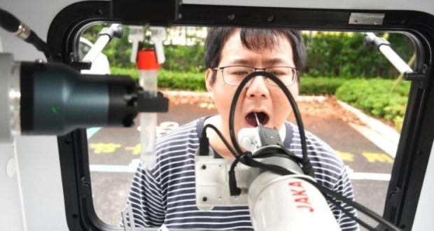 로봇 앞 입만 벌리면 30초 만에 ‘OK’…중국에 PCR 검사 AI 등장