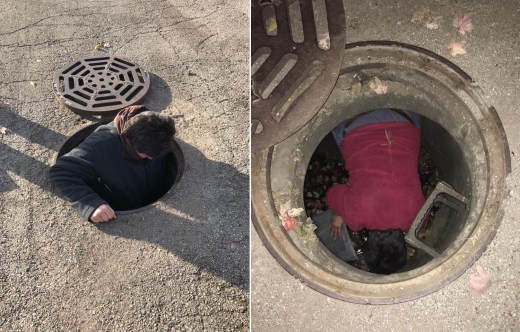 자원봉사자 스테이시가 새끼 고양이를 구조하기 위해 맨홀 뚜껑을 열고 밑으로 내려가고 있다.