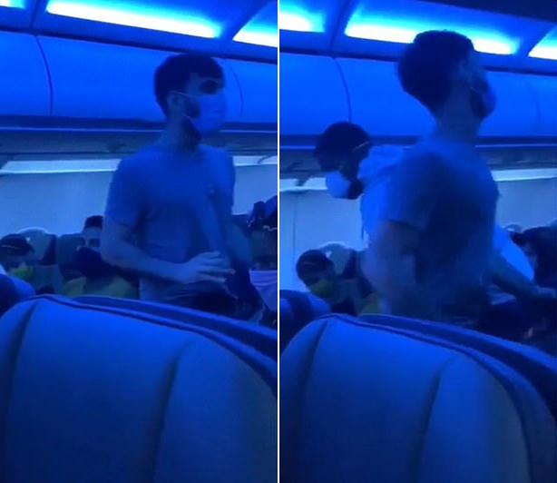 한 남성이 다른 남성과 함께 문제의 남성을 제압하기 위해 해당 남성을 반대편으로 밀치는 모습.