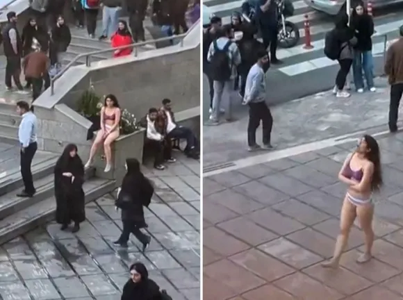 이란 수도 테헤란의 이슬람 아자드 대학 캠퍼스에서 한 여대생이 히잡 착용 요구에 속옷 차림으로 항의하고 있다. / 사진=AFP 연합뉴스