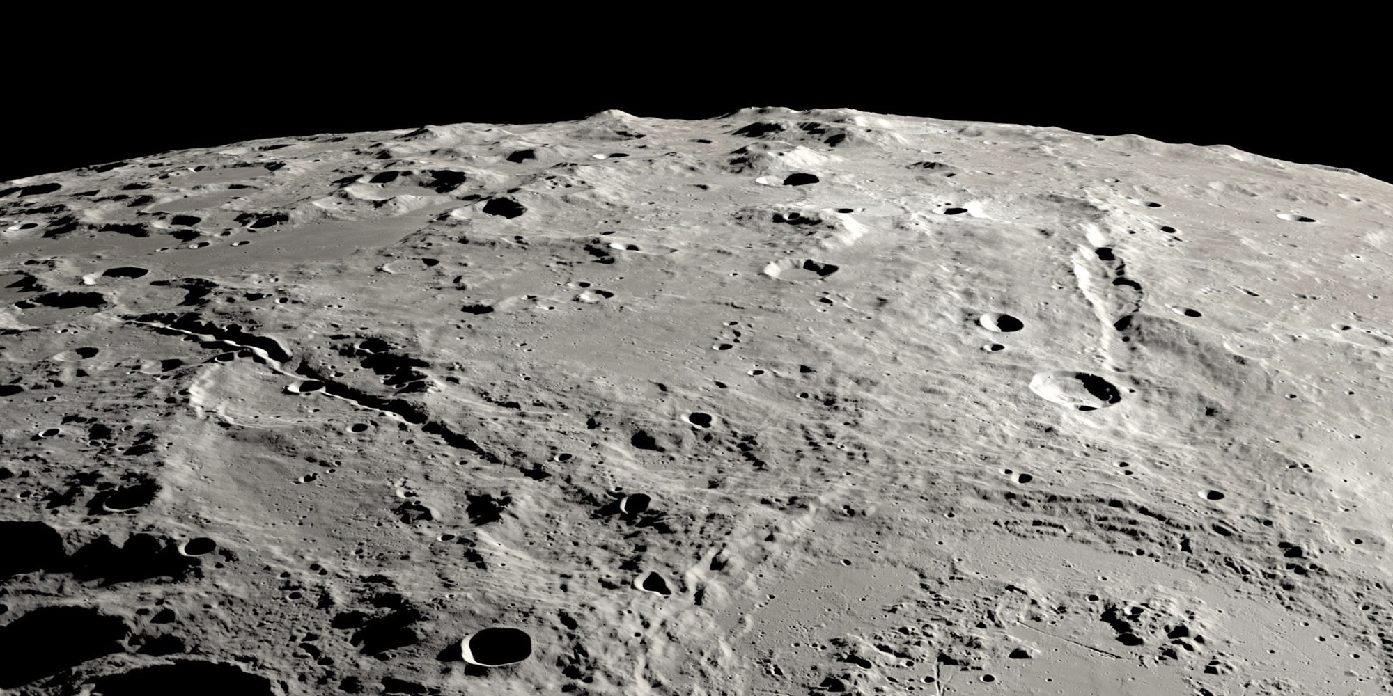 Moon?s Grand Canyons  원 모양의 슈뢰딩거 충돌구 일부와 두 협곡이 보인다.  NASA/SVS/Ernie T. Wright