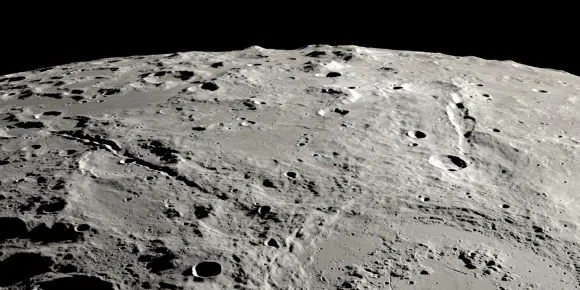 원 모양의 슈뢰딩거 충돌구 일부와 두 협곡이 보인다.  NASA/SVS/Ernie T. Wright